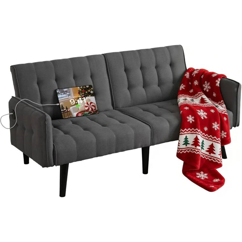 Gray sofa with a red and white blanket featuring Christmas trees and snowflakes on a white background.